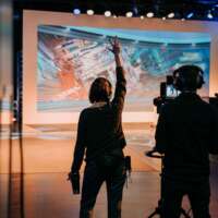 Video livestream director in studio, hand up counting down for action Hannover
