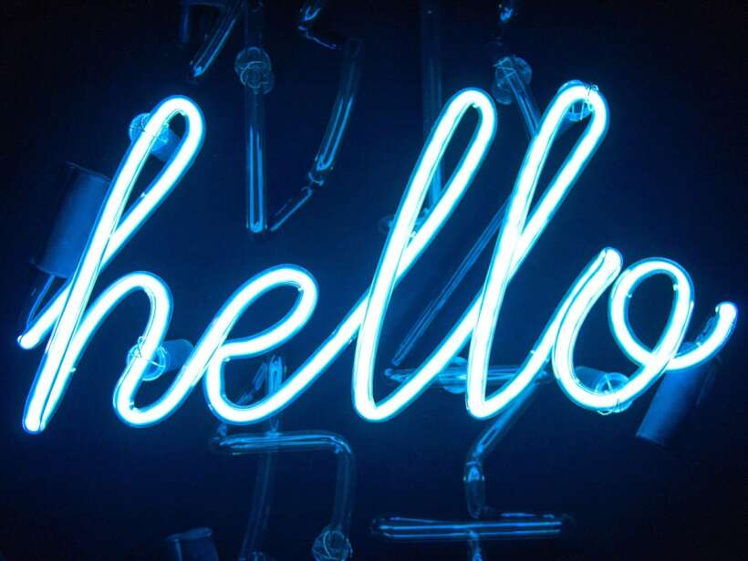 Neon sign writes "hello"