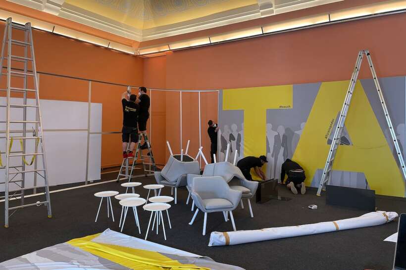 Handymen on Ladders Building a Leightweight Studio Set